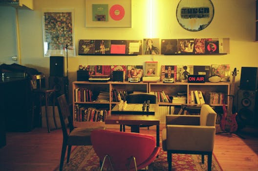 Warm interior featuring books, vinyls, and a chess set in Tirana, Albania.