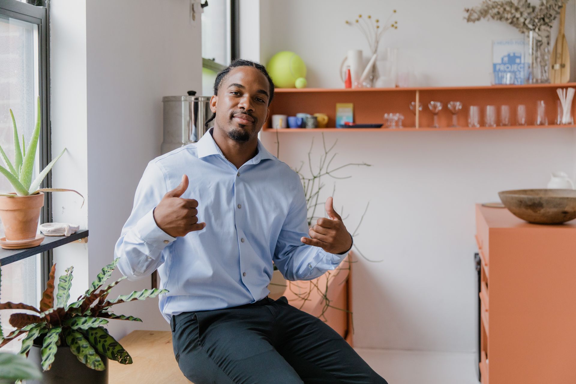 Portrait of Businessman Showing Sign Language in Office