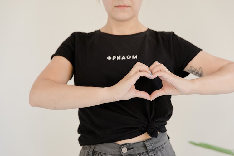 Woman Showing Heart Hand Sign