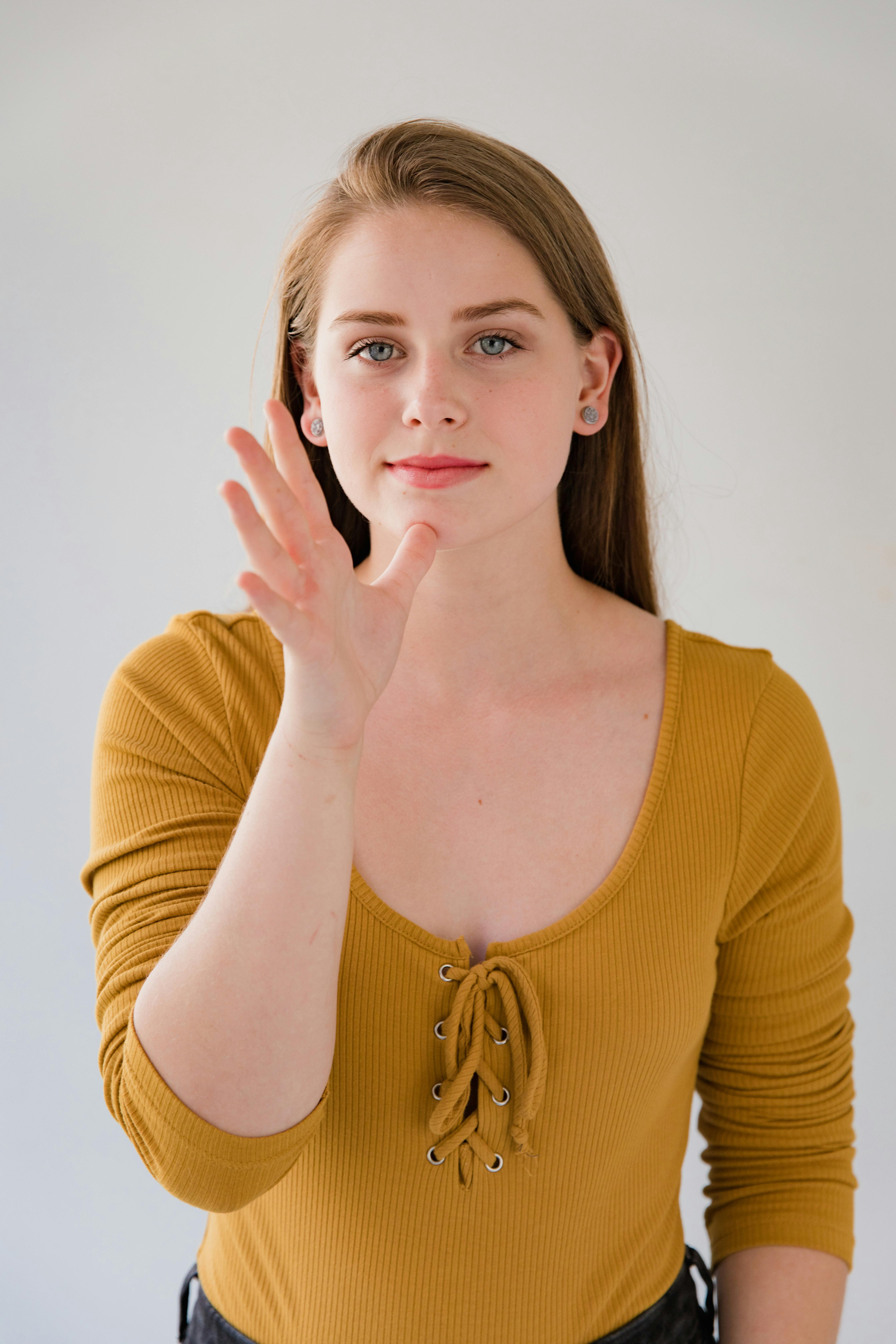 young woman using finger language