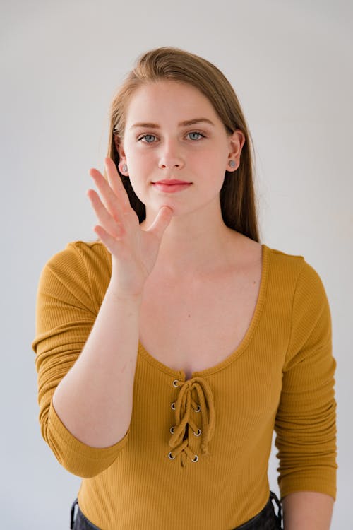 Young Woman Using Finger Language 