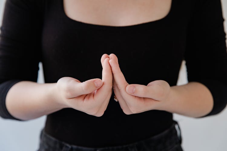 Close-up Of Woman Showing Sign Language