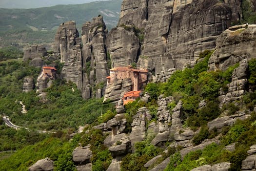 A breathtaking view of the Meteora monastery nestled among towering rocky cliffs in Greece.