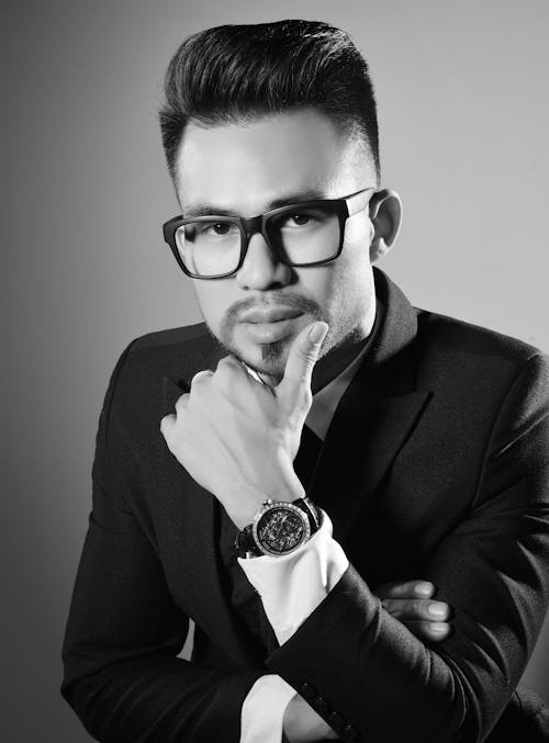 Grayscale Photo of a Man in Suit Wearing Eyeglasses