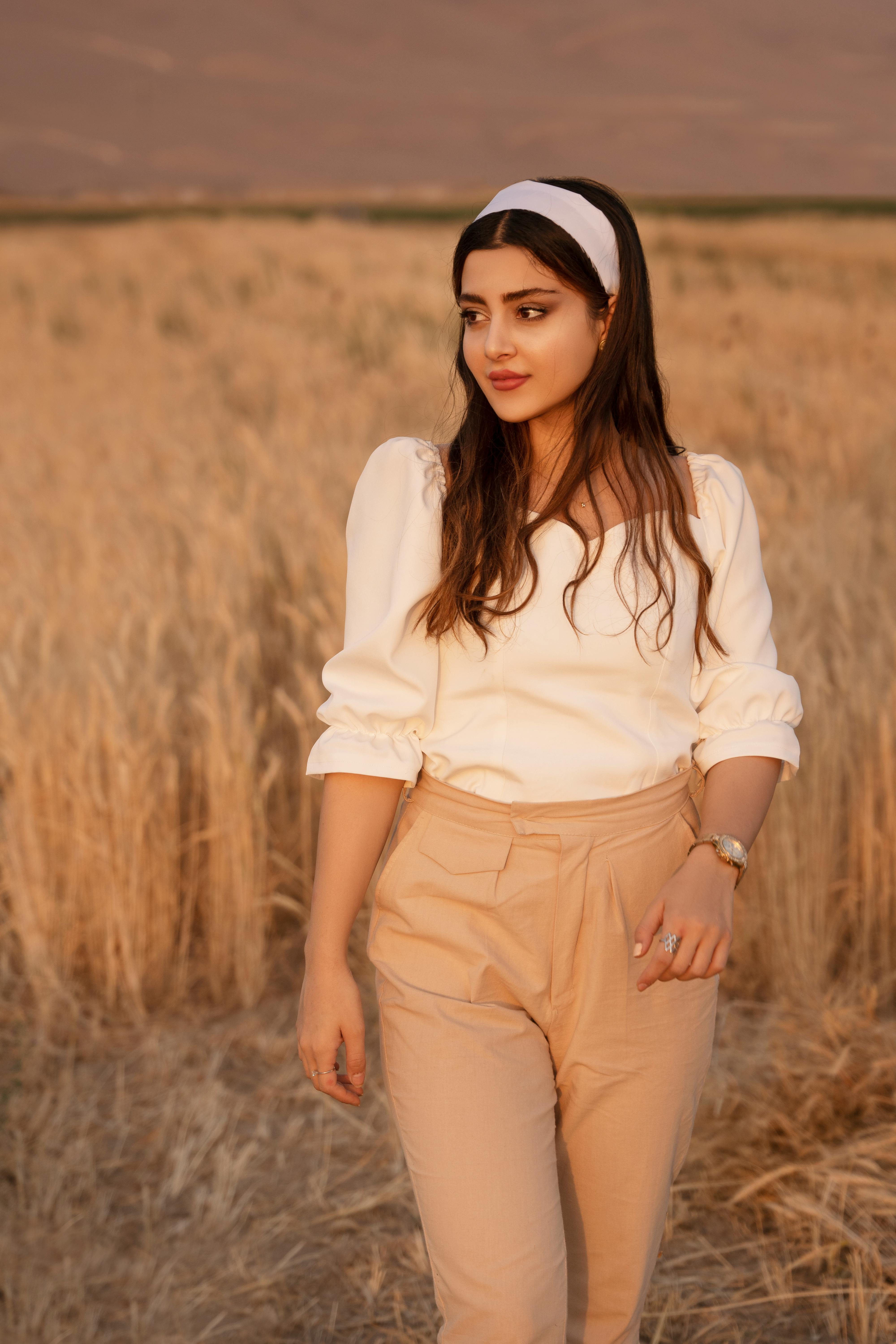 white top and brown pants