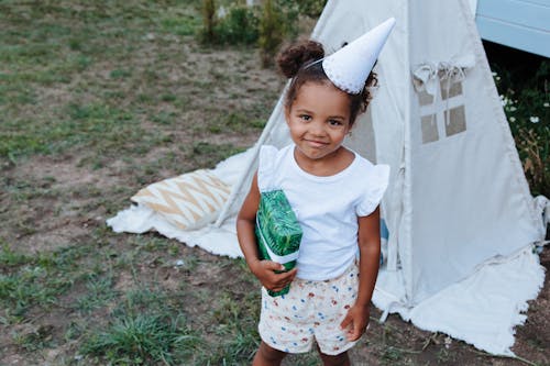Young Girl in Front of Tent