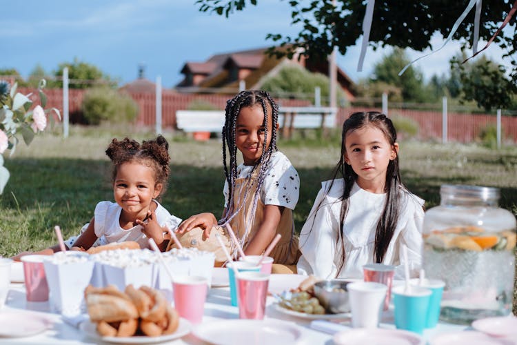 Three Young Girls On Garden Party