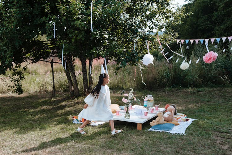 Young Girl On Garden Party