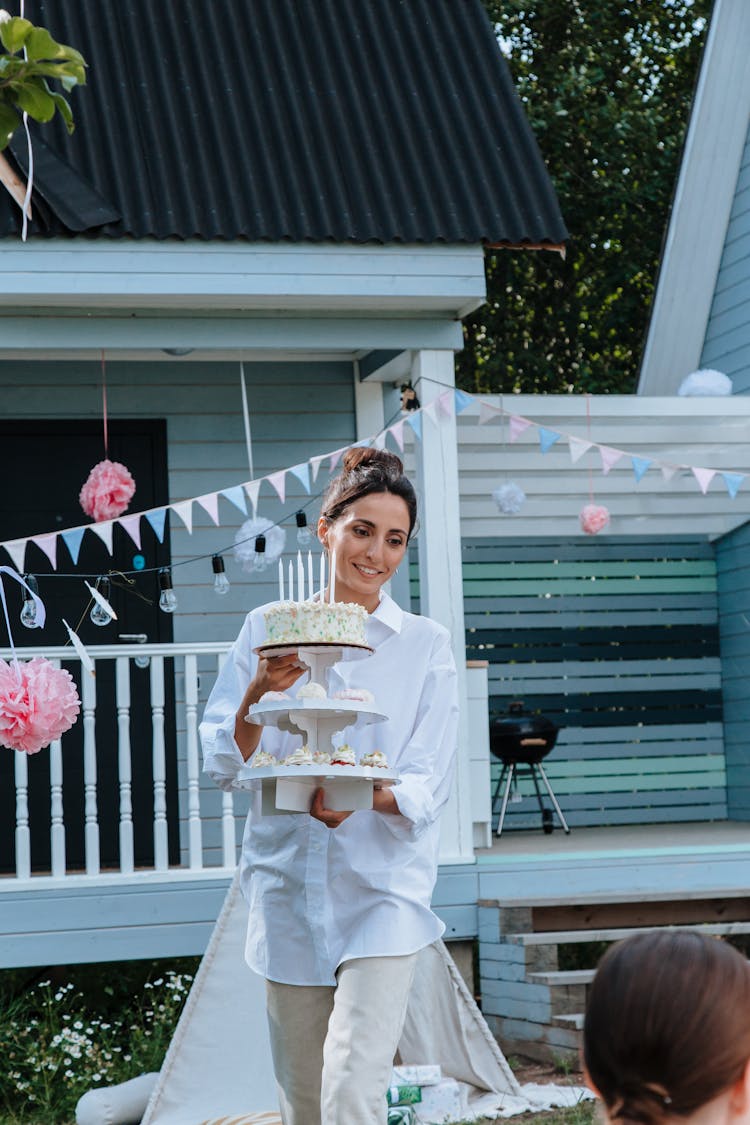 Mother Holding Birthday Cake