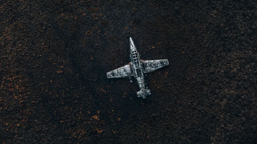Aerial view of an aircraft airframe in a field at dusk — photo by urtimud.89 on Pexels