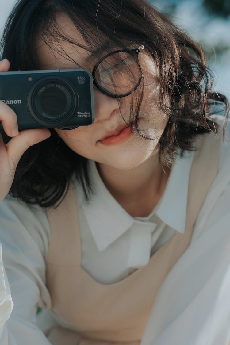 Woman Looking Through Camera