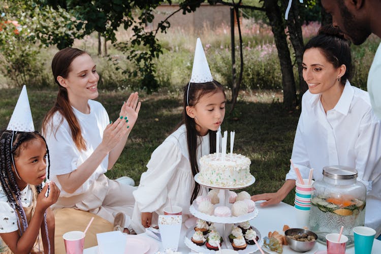 Family Celebrating Birthday In Garden