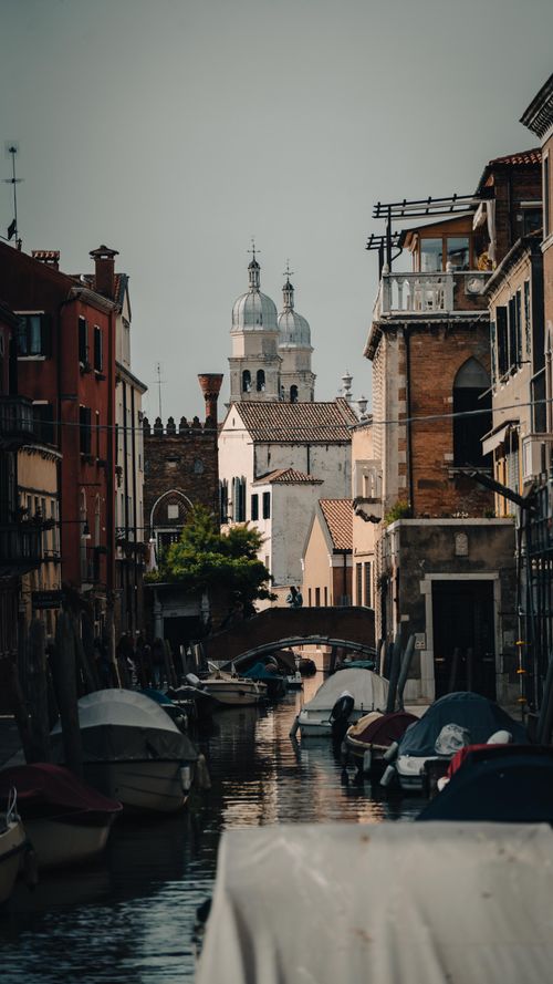 Free A picturesque canal in Venice showcasing classic architecture and boats, perfect for travel and exploration. Stock Photo