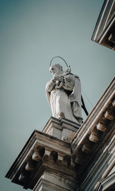 A Statue on Top of a Building