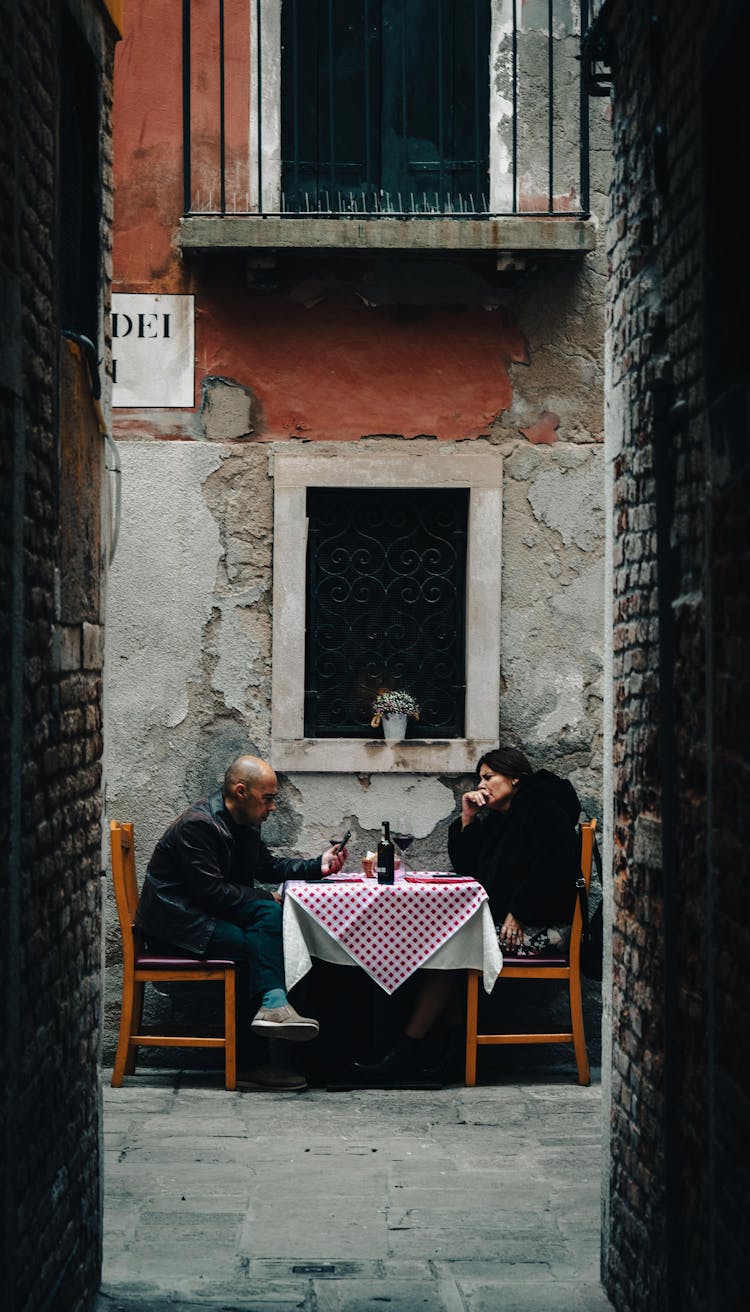 Adult Couple Having Talk In House Yard