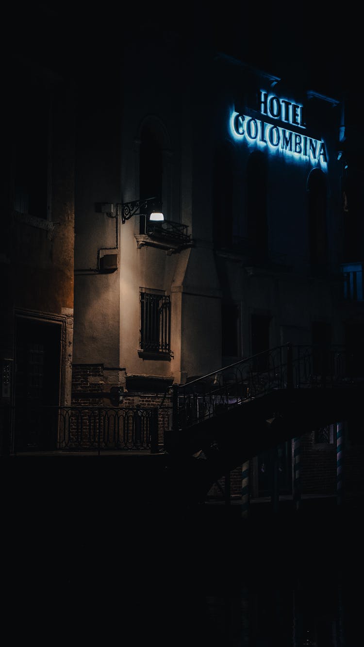Hotel Illuminated By A Lone Street Light At Night