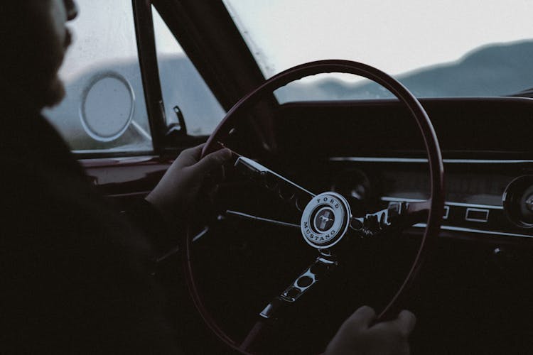 Man Driving A Vintage Car