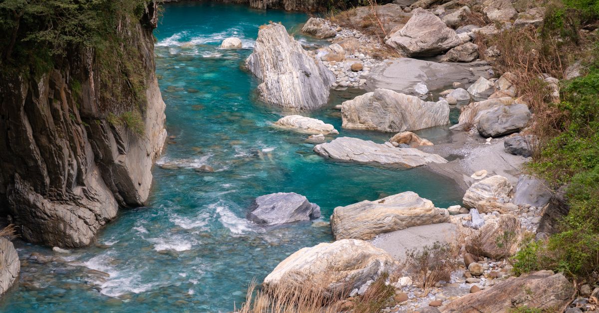A turquoise river running through the marble walls of Taroko Gorge, Taiwan