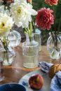 Fresh Flowers in Glass Vases on a Wooden Table