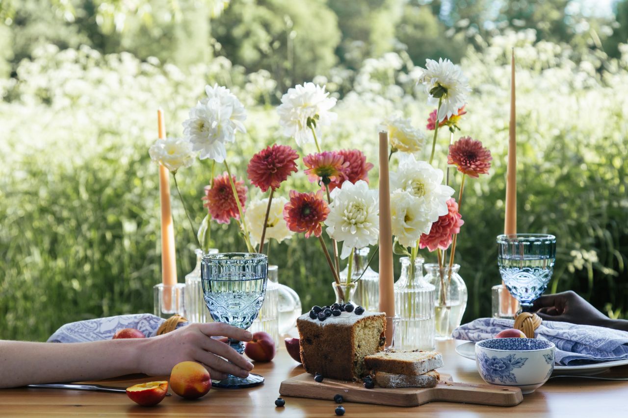 Outdoor dinner table set with candles