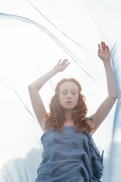 Beautiful Woman Raising Her Arms