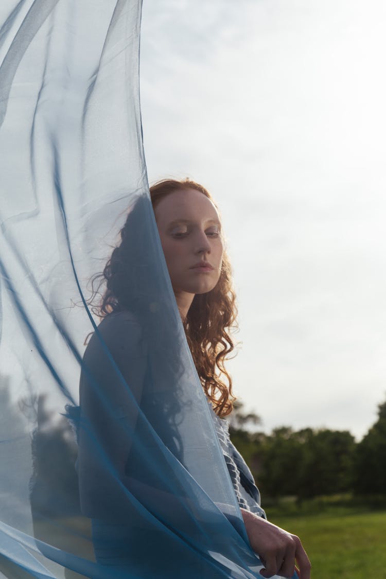 A Woman Draped In Chiffon Fabric