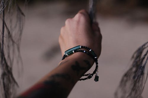 Hand Wearing Thin Beads Bracelets