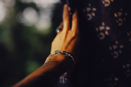 Hand of Young Person with Bracelet and Ring