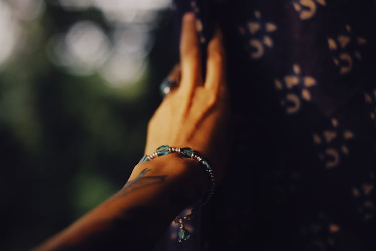 Hand Of Young Person With Bracelet And Ring