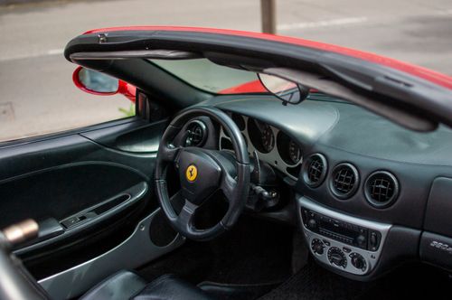 Free Explore the luxurious interior of a convertible sports car featuring a stylish dashboard. Stock Photo