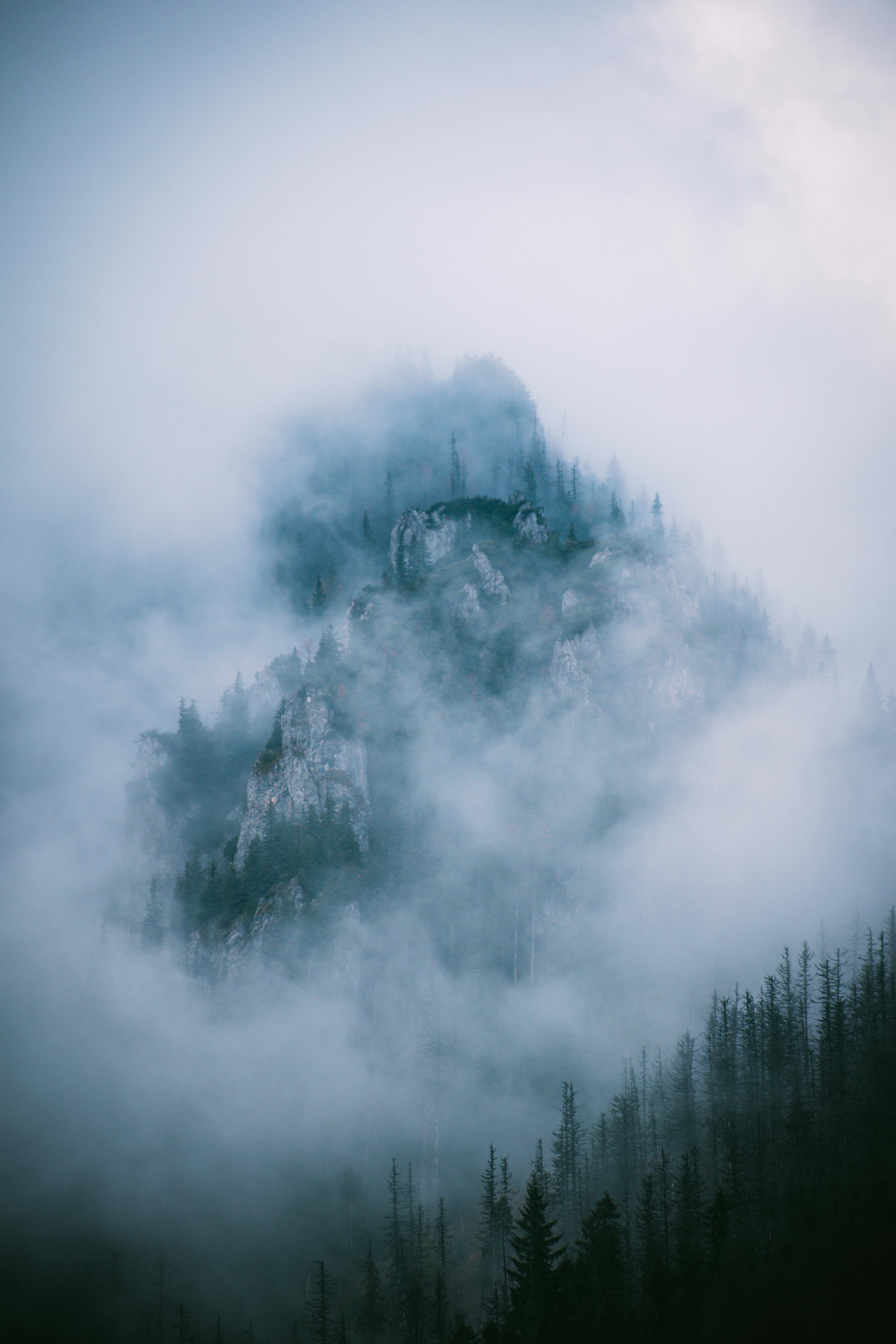 Enigmatic fog envelops the peaks of Vysoké Tatry, Slovakia, creating a mystical landscape.