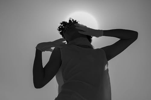 Free A Grayscale of a Man Wearing a Tank Top and Gloves Stock Photo