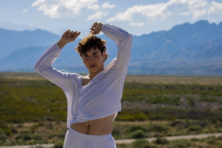 A Man In White Long Sleeve Shirt Dancing