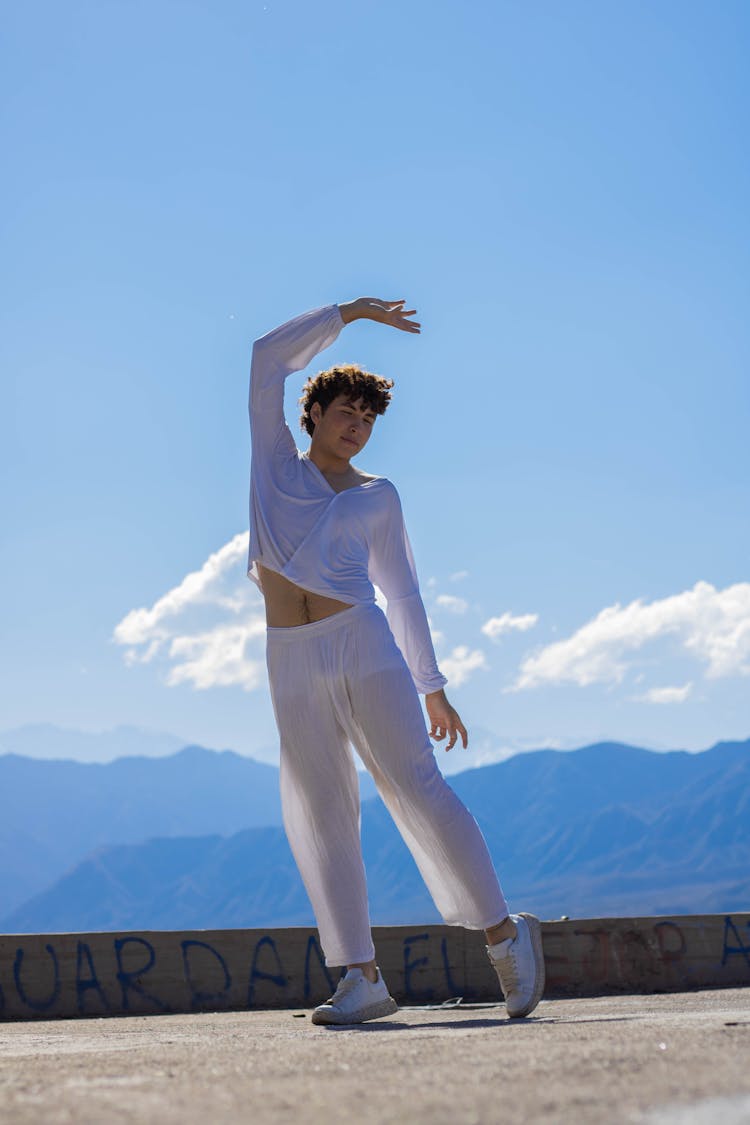 Man In White Shirt Raising His Arm