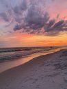 People Walking on Beach during Sunset