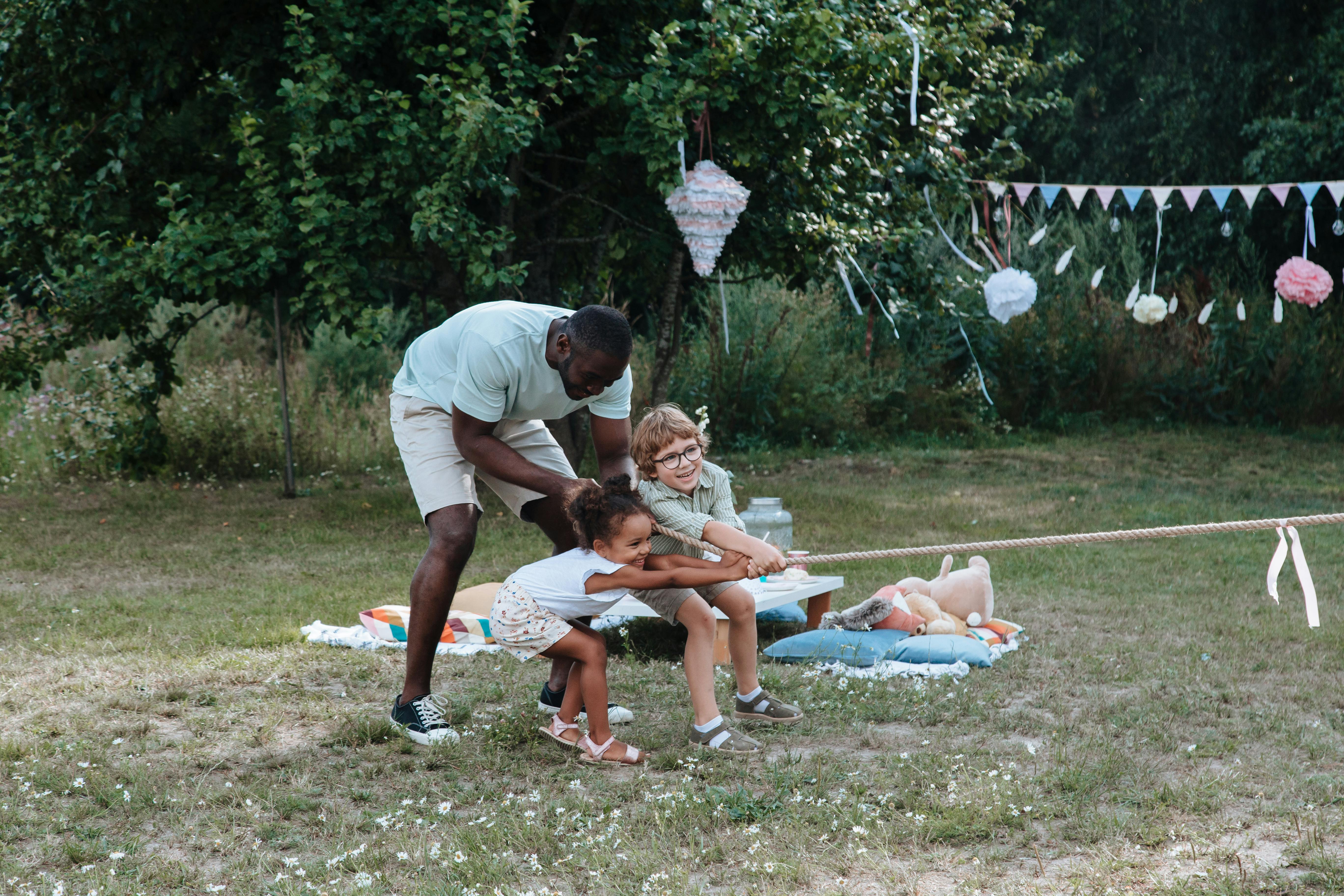 happy family playing in a park - home pickup laundry service near me