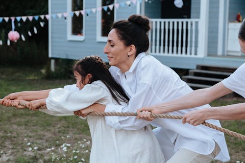 Mother and Daughter Playing Tug of War