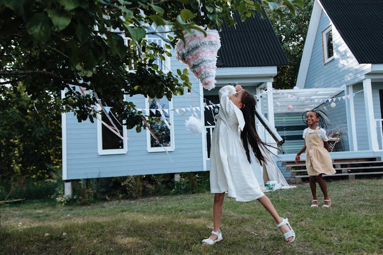 Young Girl Hitting Pinata