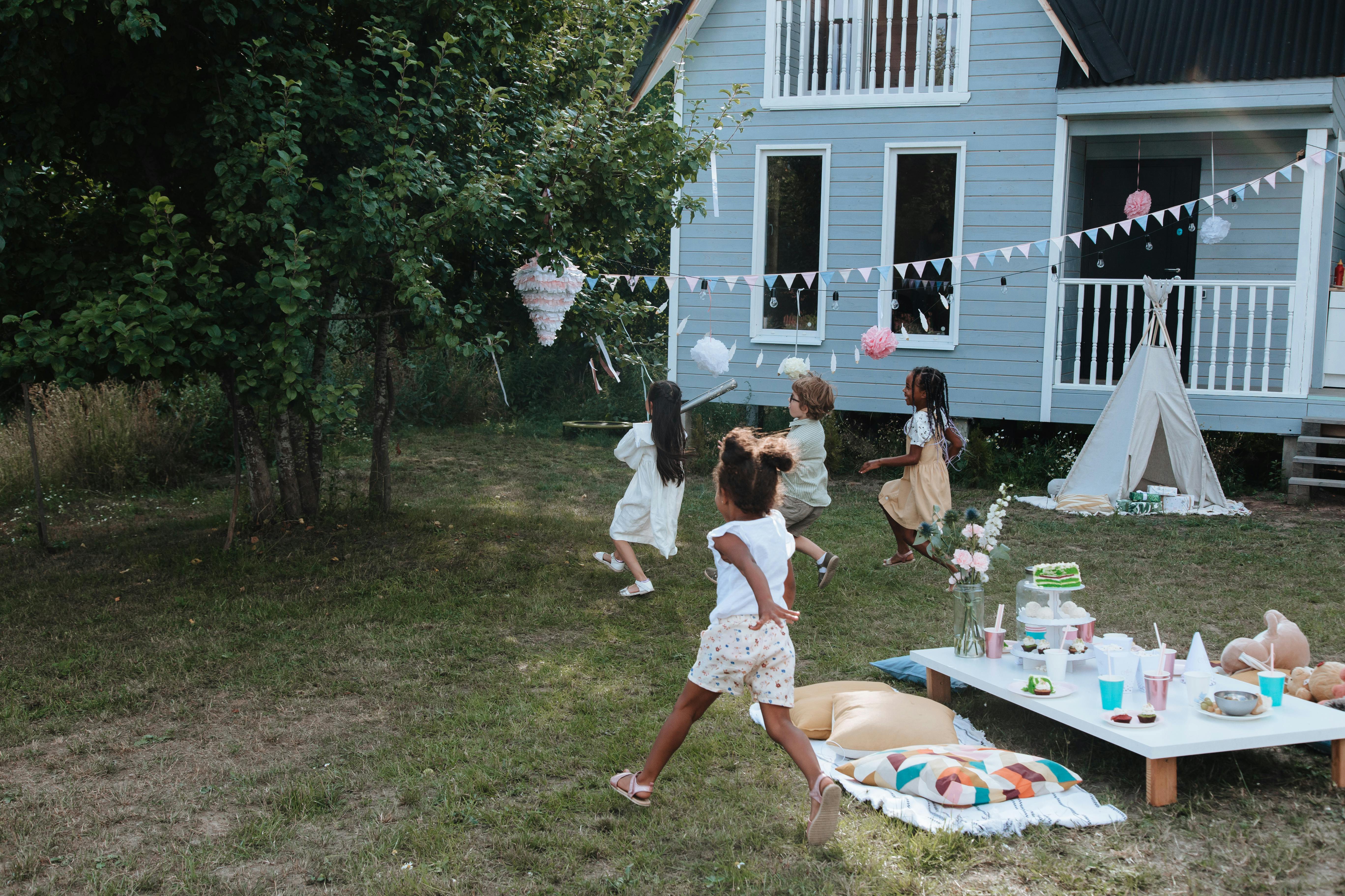 kids running from table to pinata