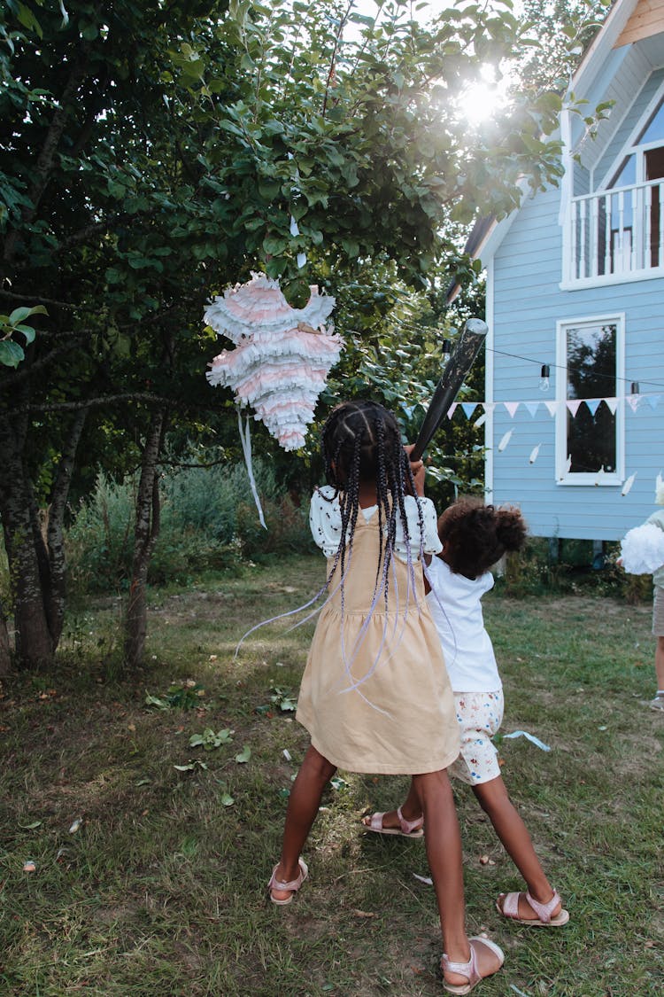 Girls Hitting Pinata