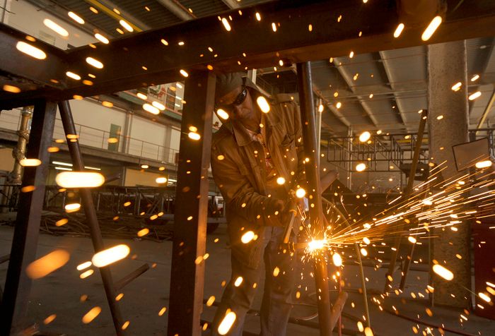 Hobbyist welder practicing beads on a steel frame