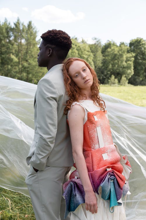 Man and Woman Standing Back to Back