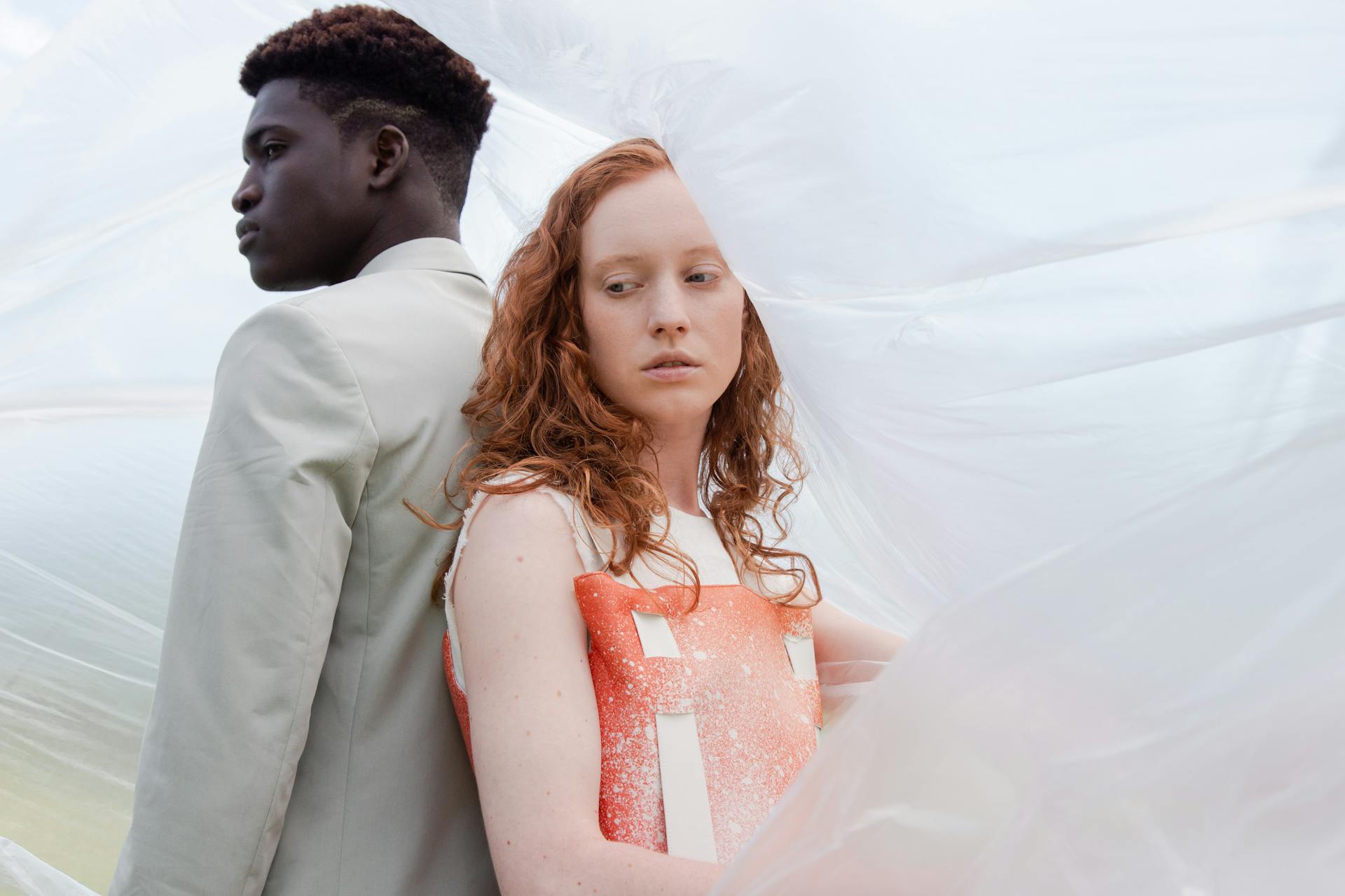 A Man and a Woman Surrounded by Plastic Wrapper