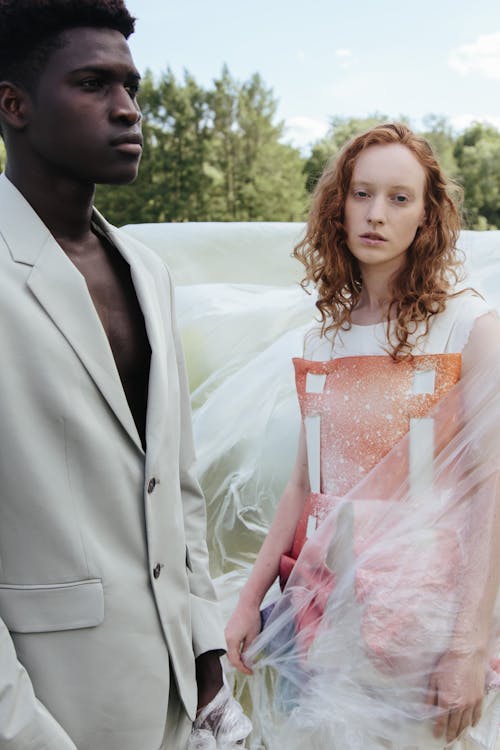 Man and Woman Wearing Fashionable Clothes