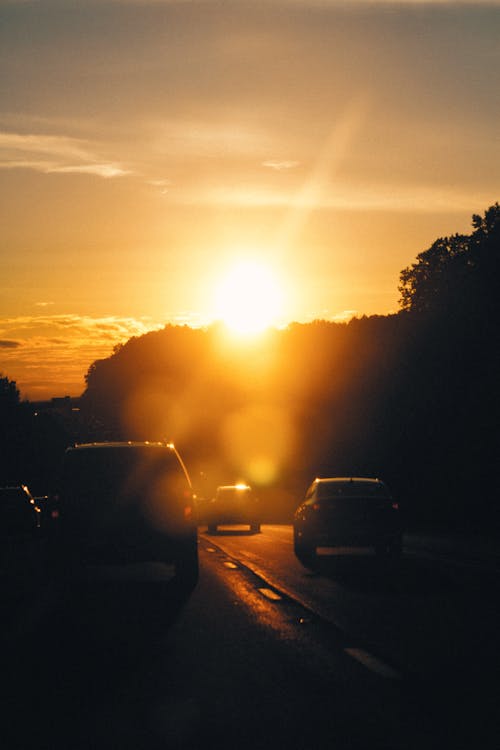Free Cars on the Road during Sunset Stock Photo