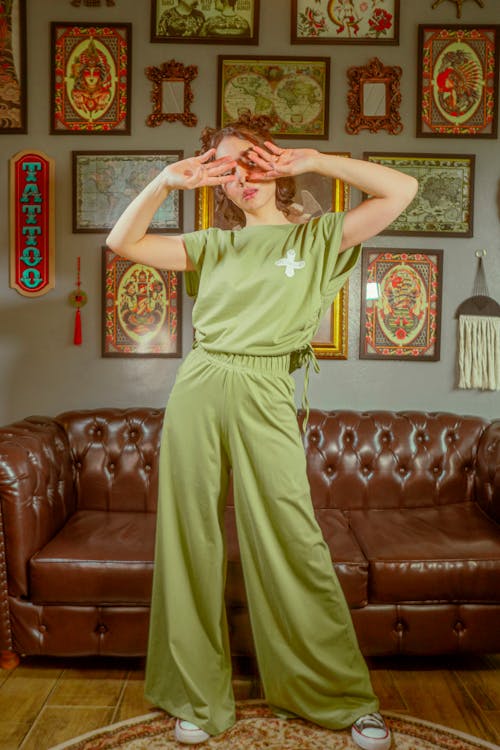 Free Woman Standing in Room, Covering Face with Hands Stock Photo