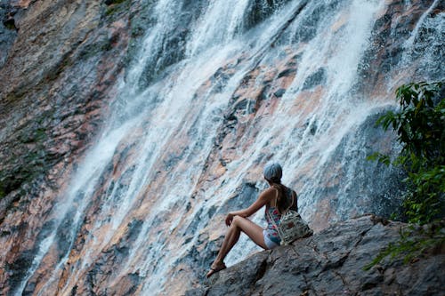 Free Woman Near Waterfalls Stock Photo