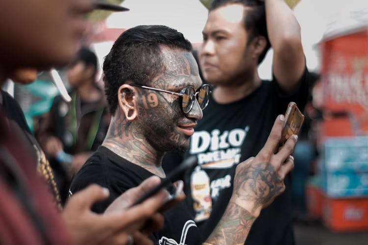 Man With Gray Wash In Full Face Tattoo