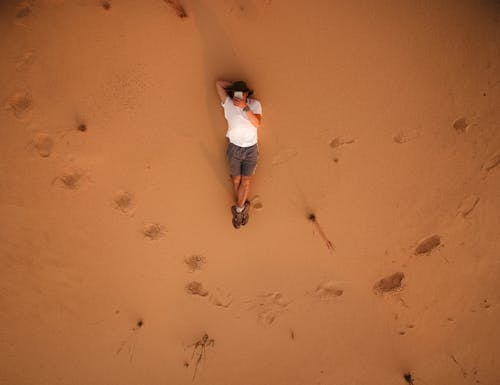 Man Lying on Sand