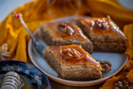 Close-up of baklava slices with honey and walnuts, perfect dessert photography.